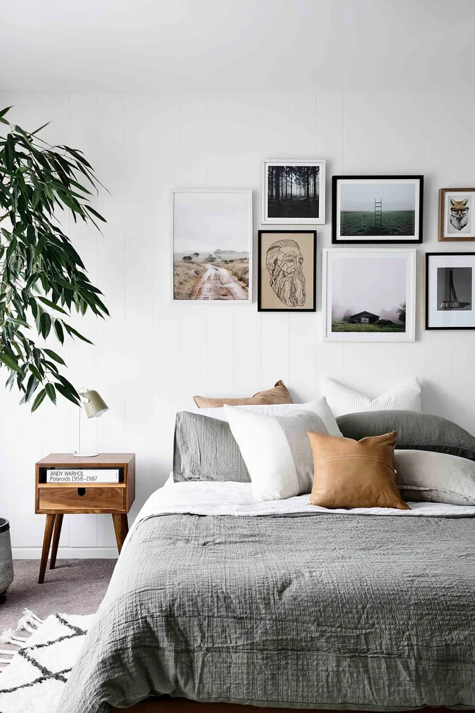 Evocative artworks above the bed are all characteristics of Scandi interiors and mostly connected to nature. “The broom is a photo of mine, Az drew the face and others are of Scandinavia,” says Jamie.