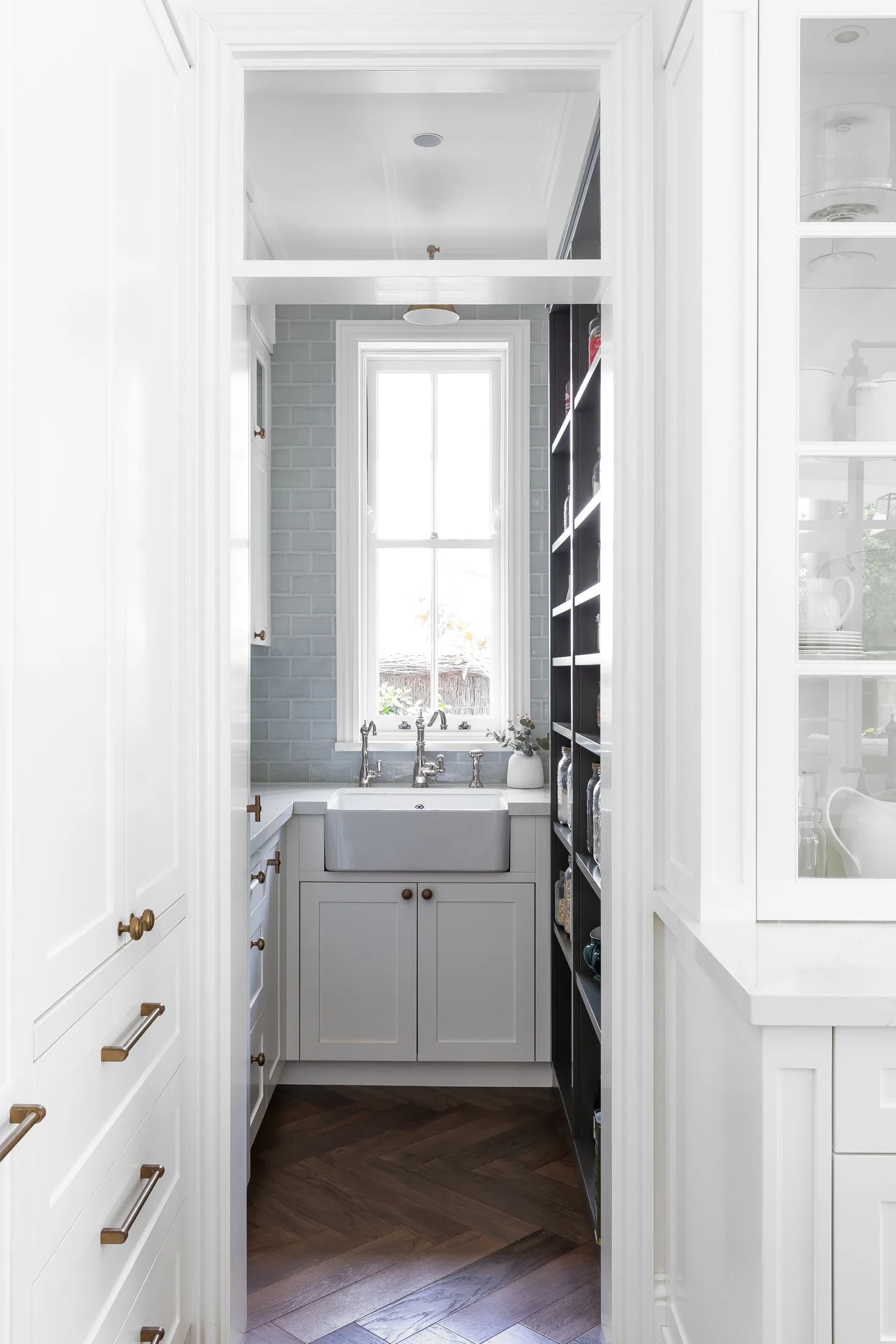 Butler's pantry with herringbone timber floor