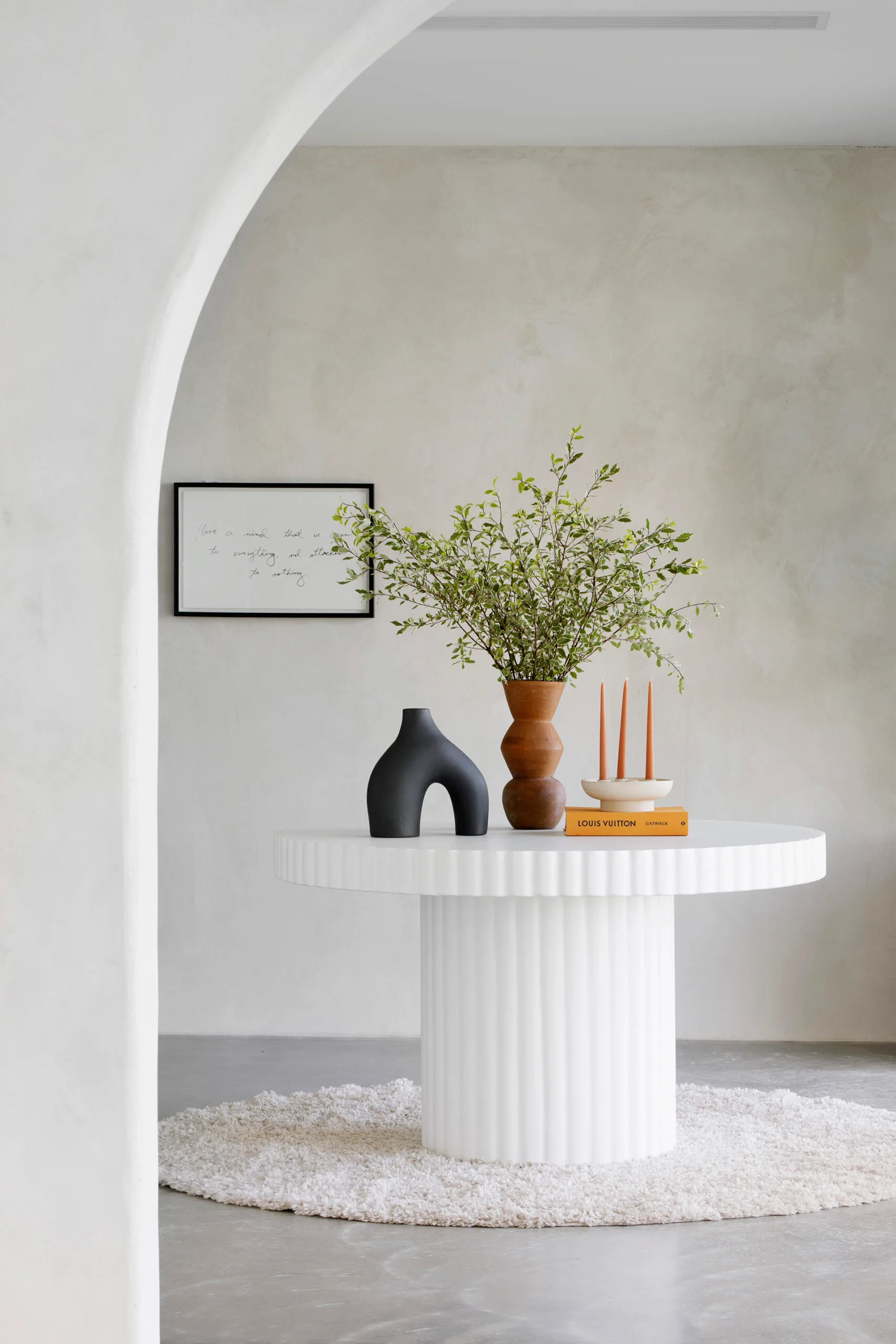 contemporary home entrance round white table