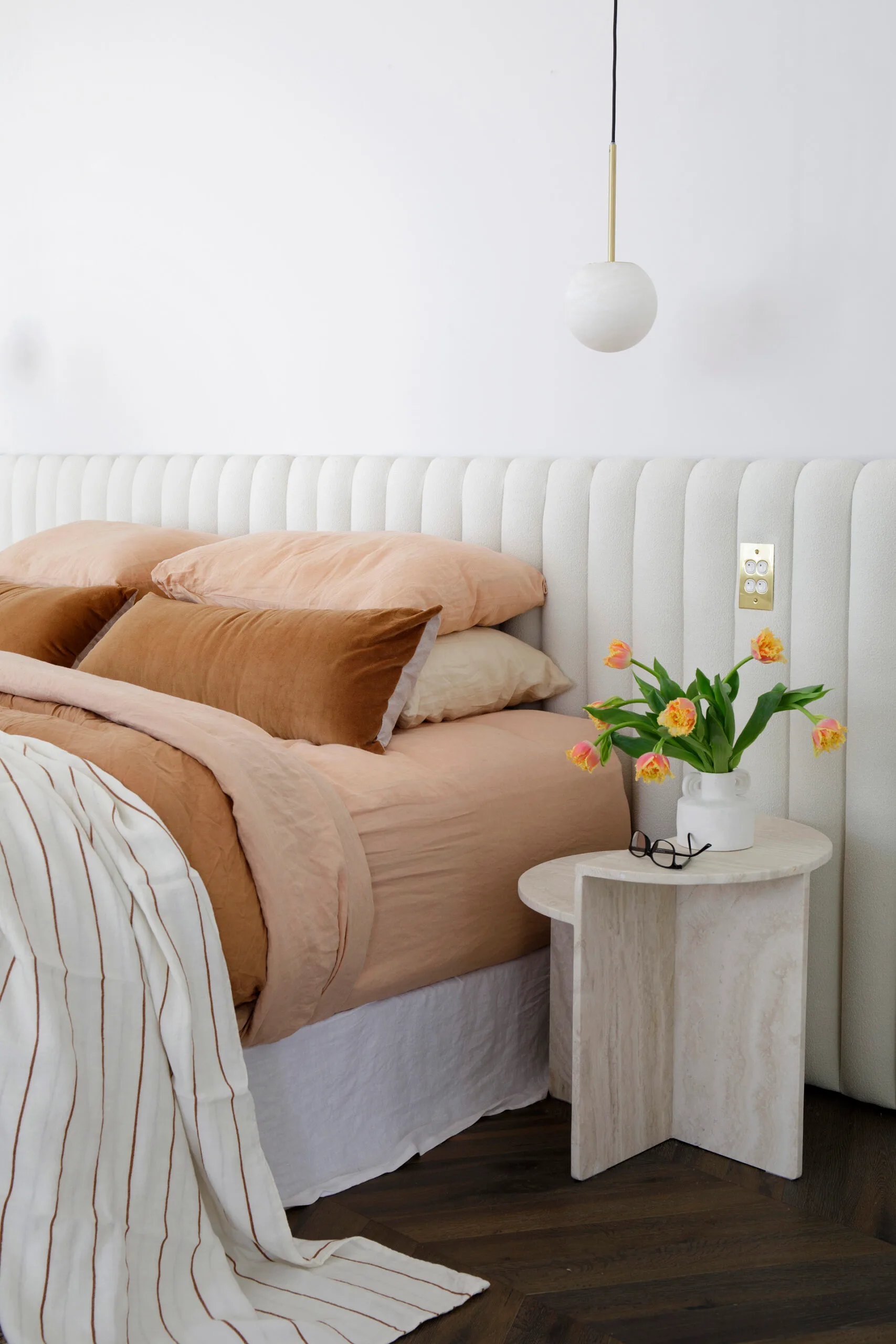 contemporary bedroom with white upholstered bedhead