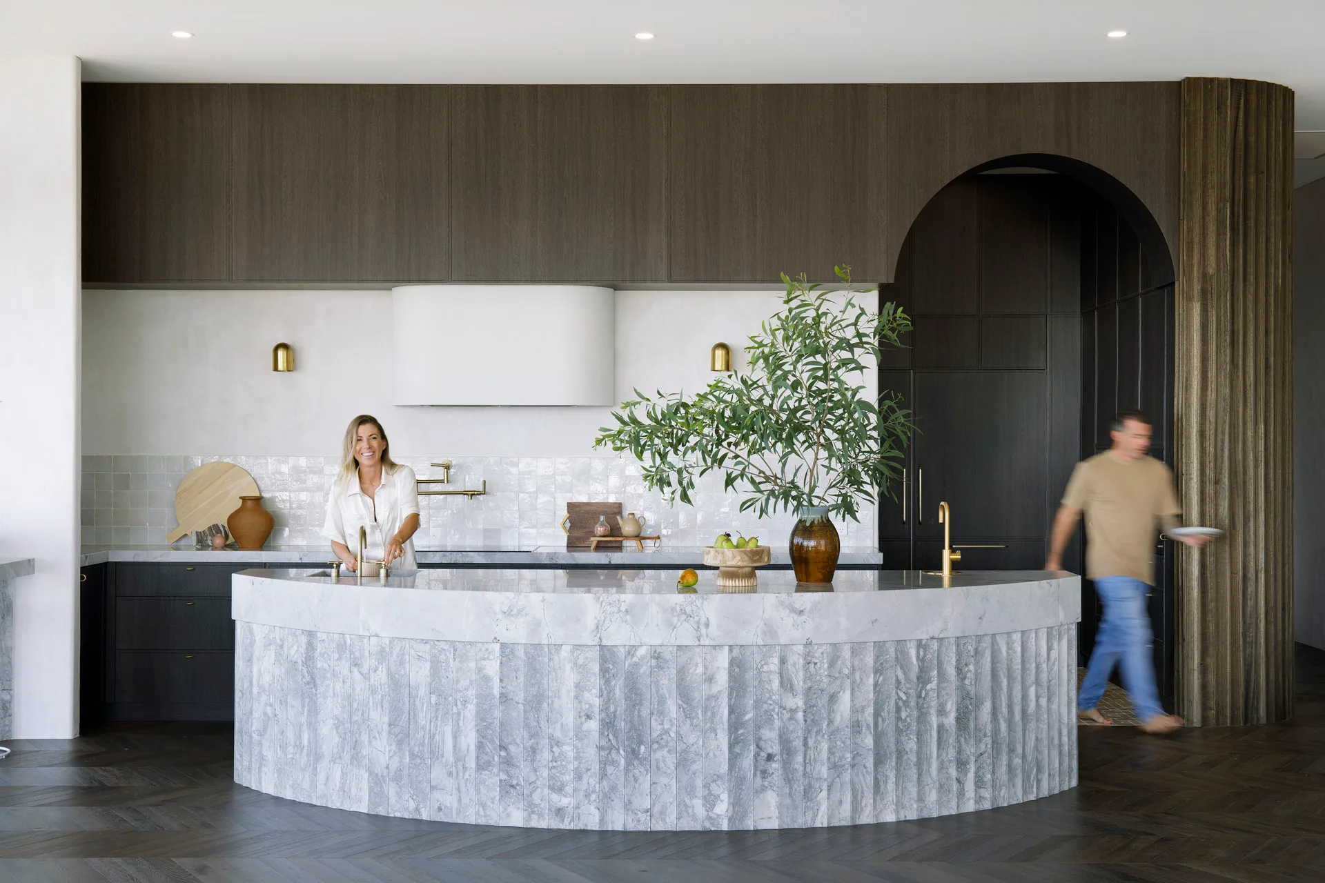 contemporary kitchen with curved marble kitchen island