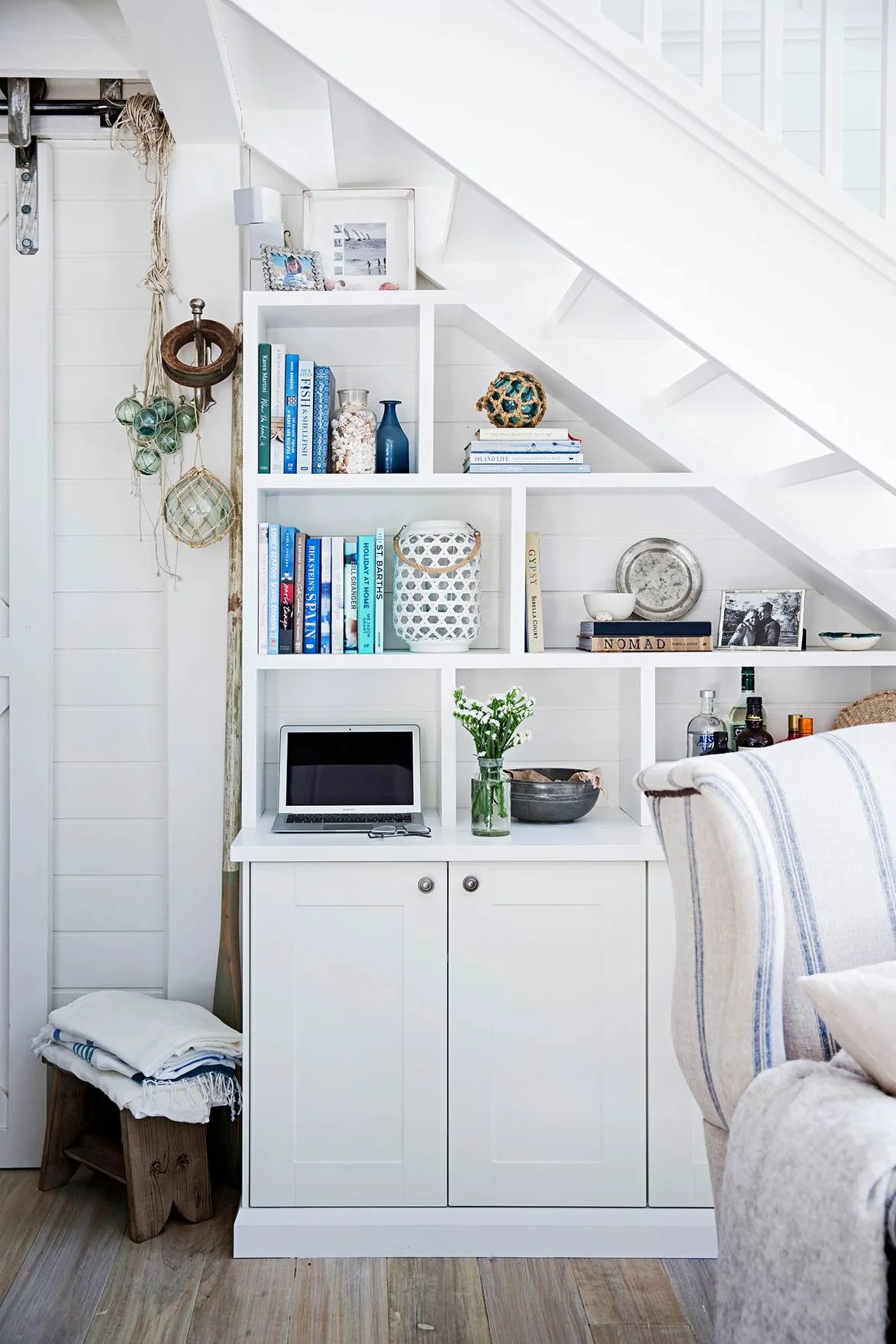 bookshelf under the stairs