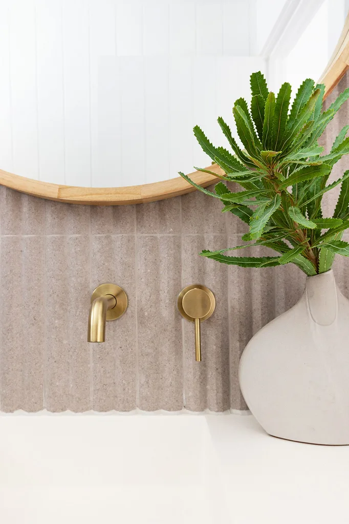 Powder room detail with fluted tiles