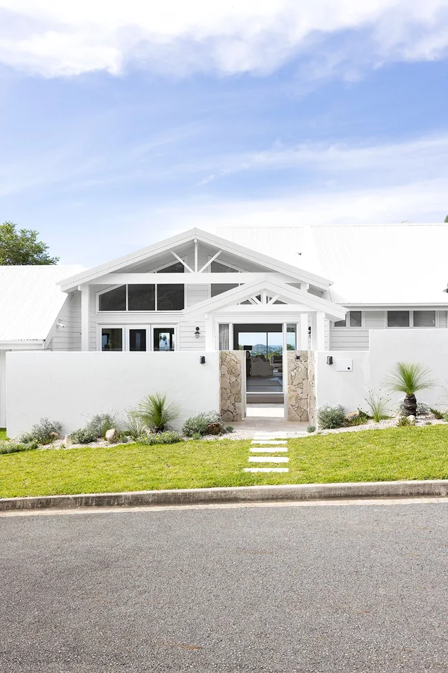 Resort-style renovated 1980s coastal home exterior