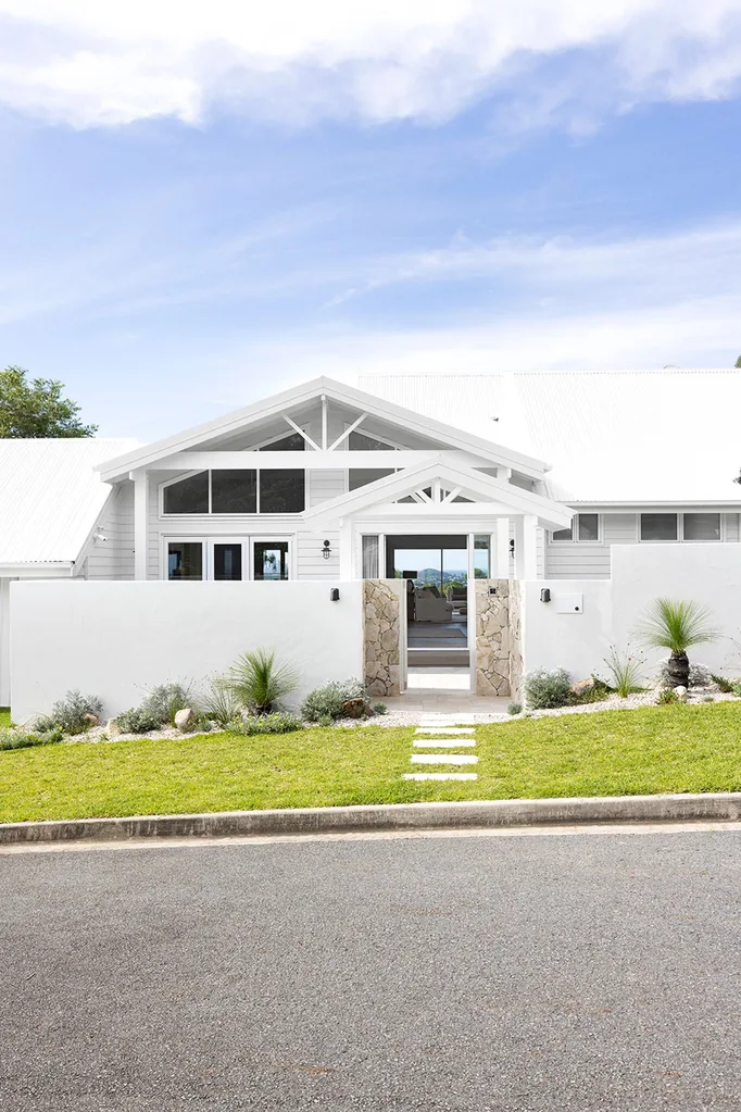 Resort-style renovated 1980s coastal home exterior