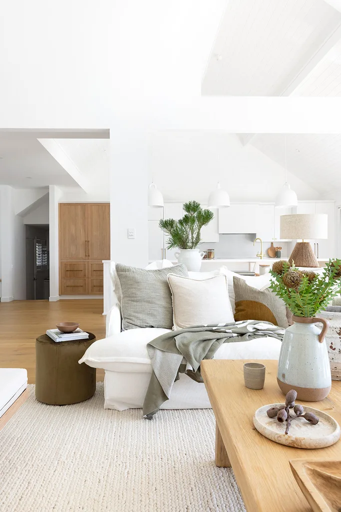 Light bright open plan kitchen living room with timber integrated fridge