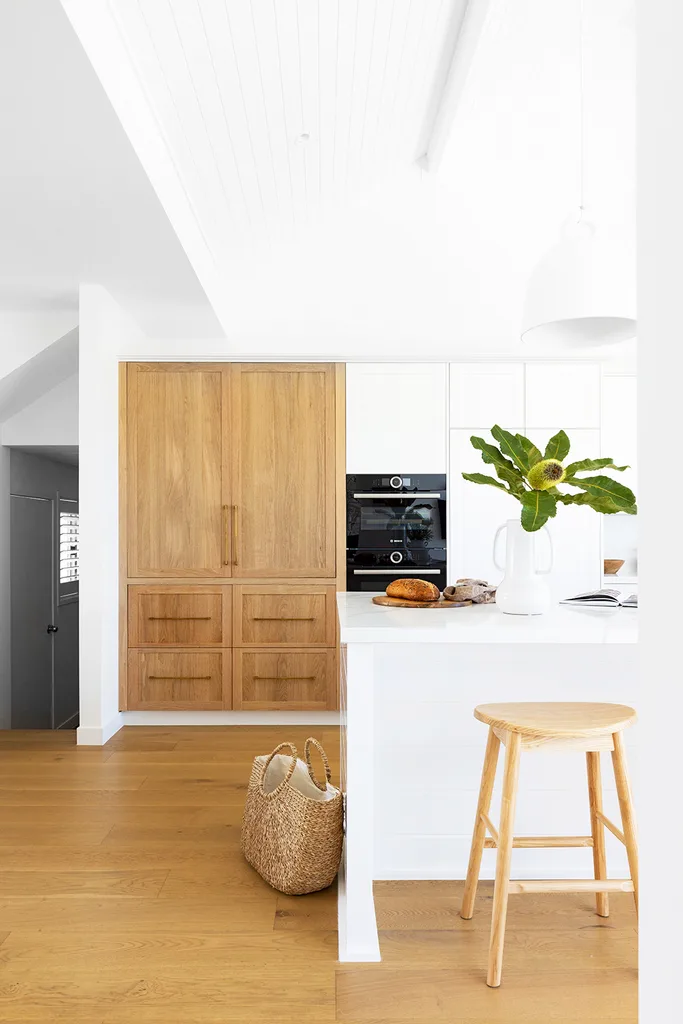 Light coastal kitchen with timber and white cabinetry