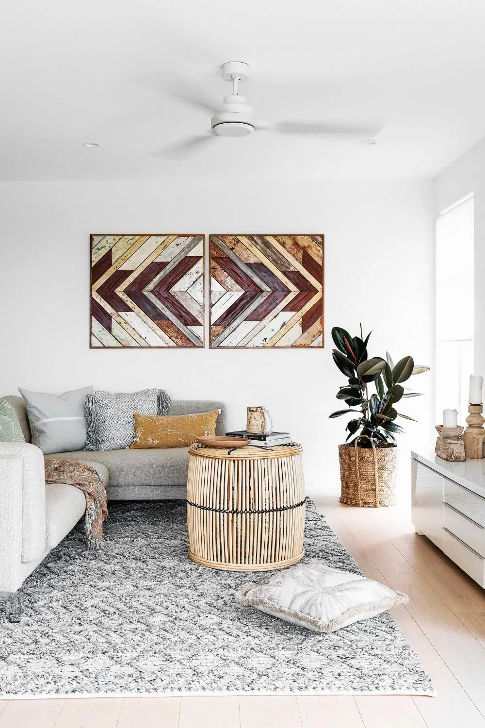 Coastal living room with rubber tree in corner