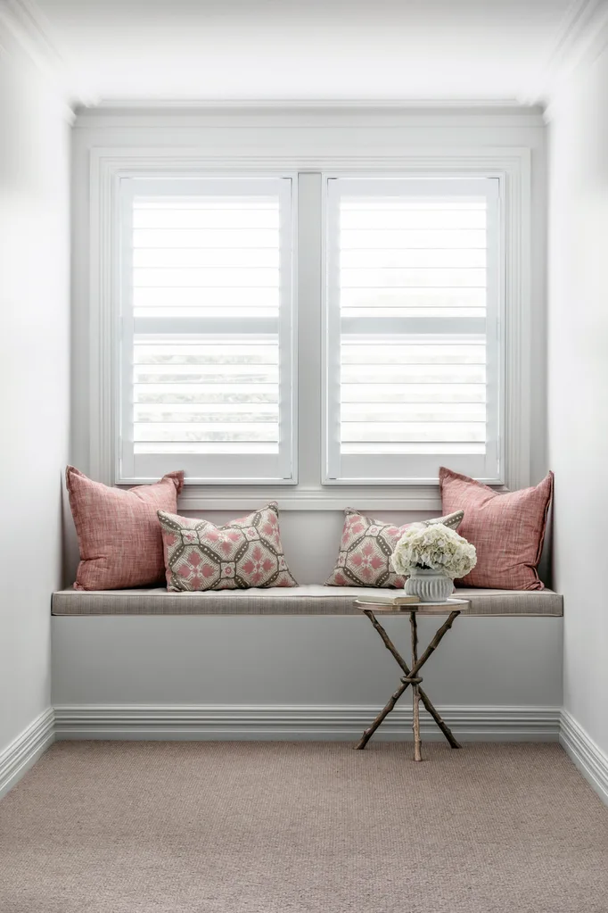 Hamptons style home with pink window seat