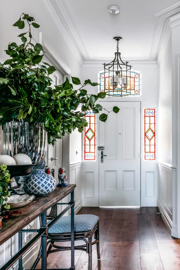 Hamptons style hallway with stained glass front door