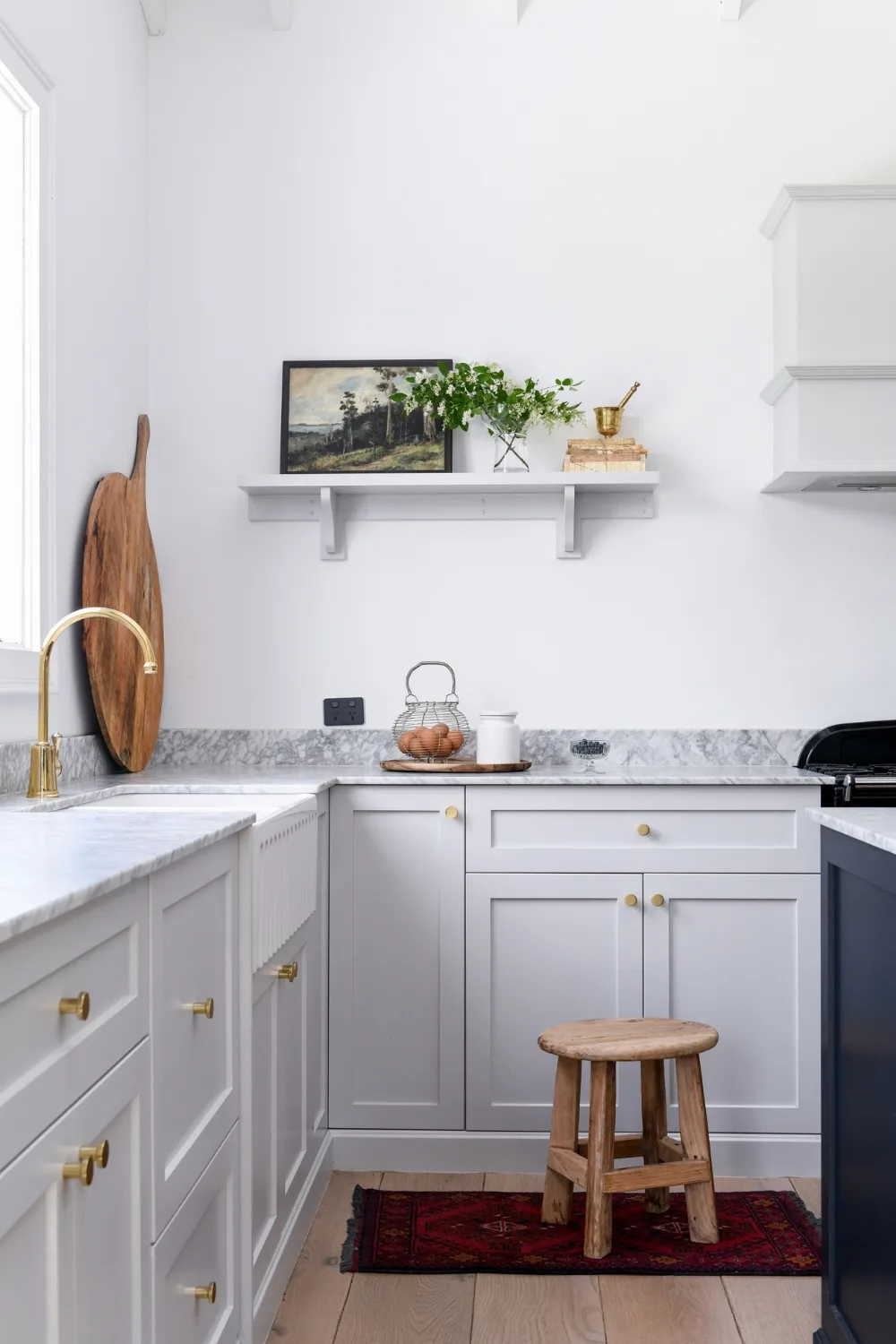 Soft grey kitchen with marble countertops