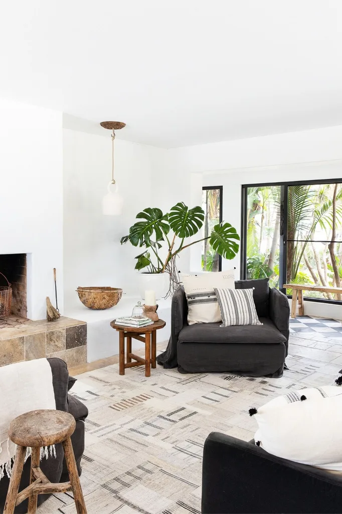 Large monstera plant in a Scandi-style living room