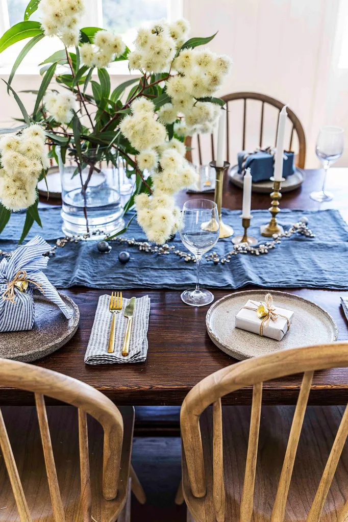 Festive table setting with gold cutlery