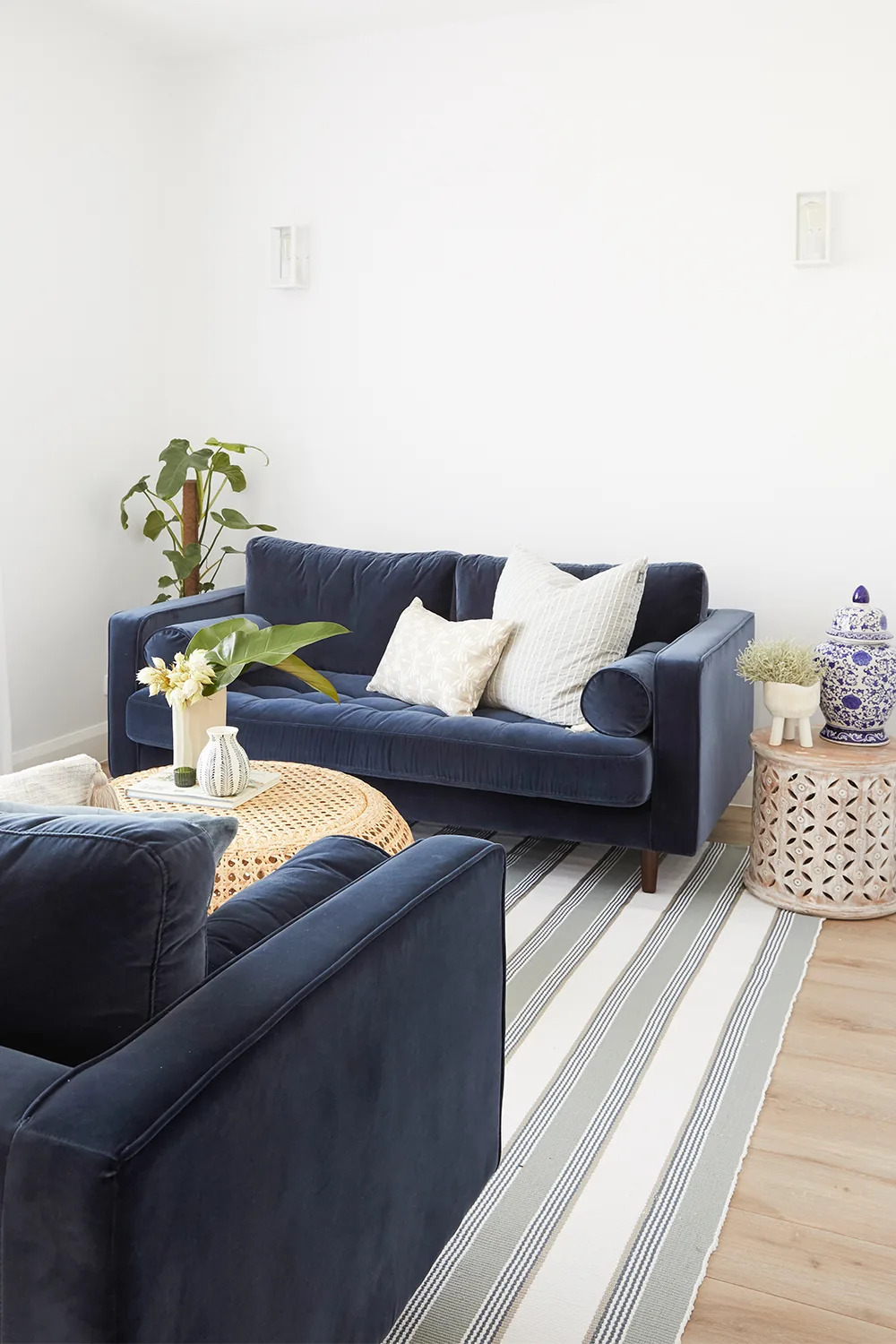 Matching navy blue velvet sofas