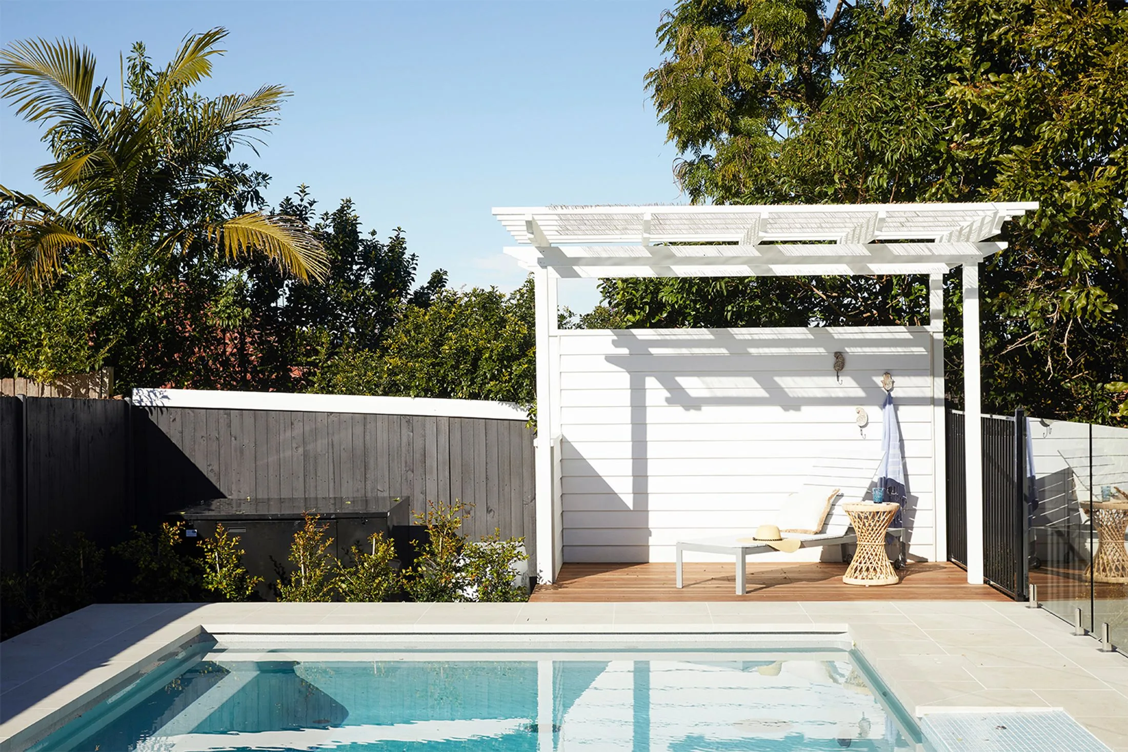 Swimming pool with cabana pergola