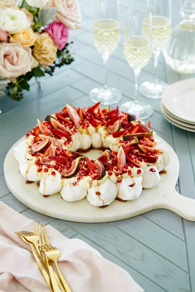 Celebration pavlova wreath with strawberries and pomegranate