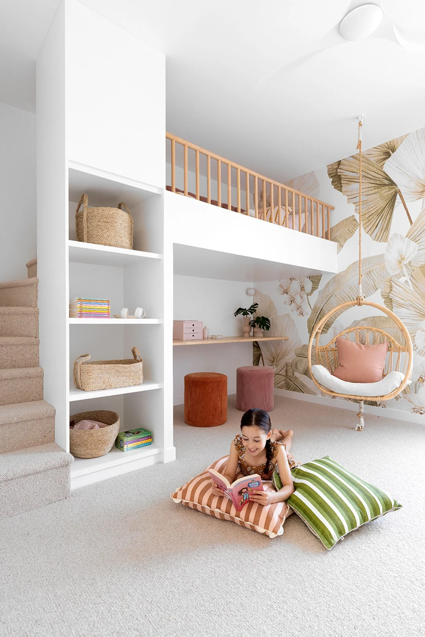 kids room with hanging chair and loft bed with desk nook underneath