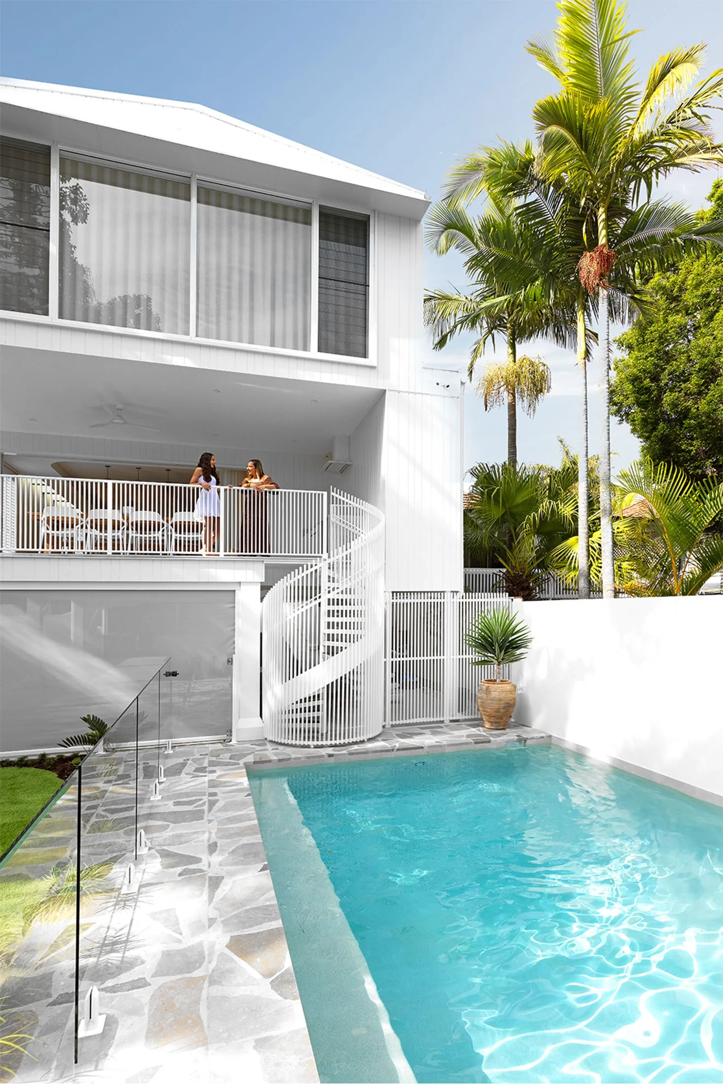 Swimming pool in light white Brisbane backyard