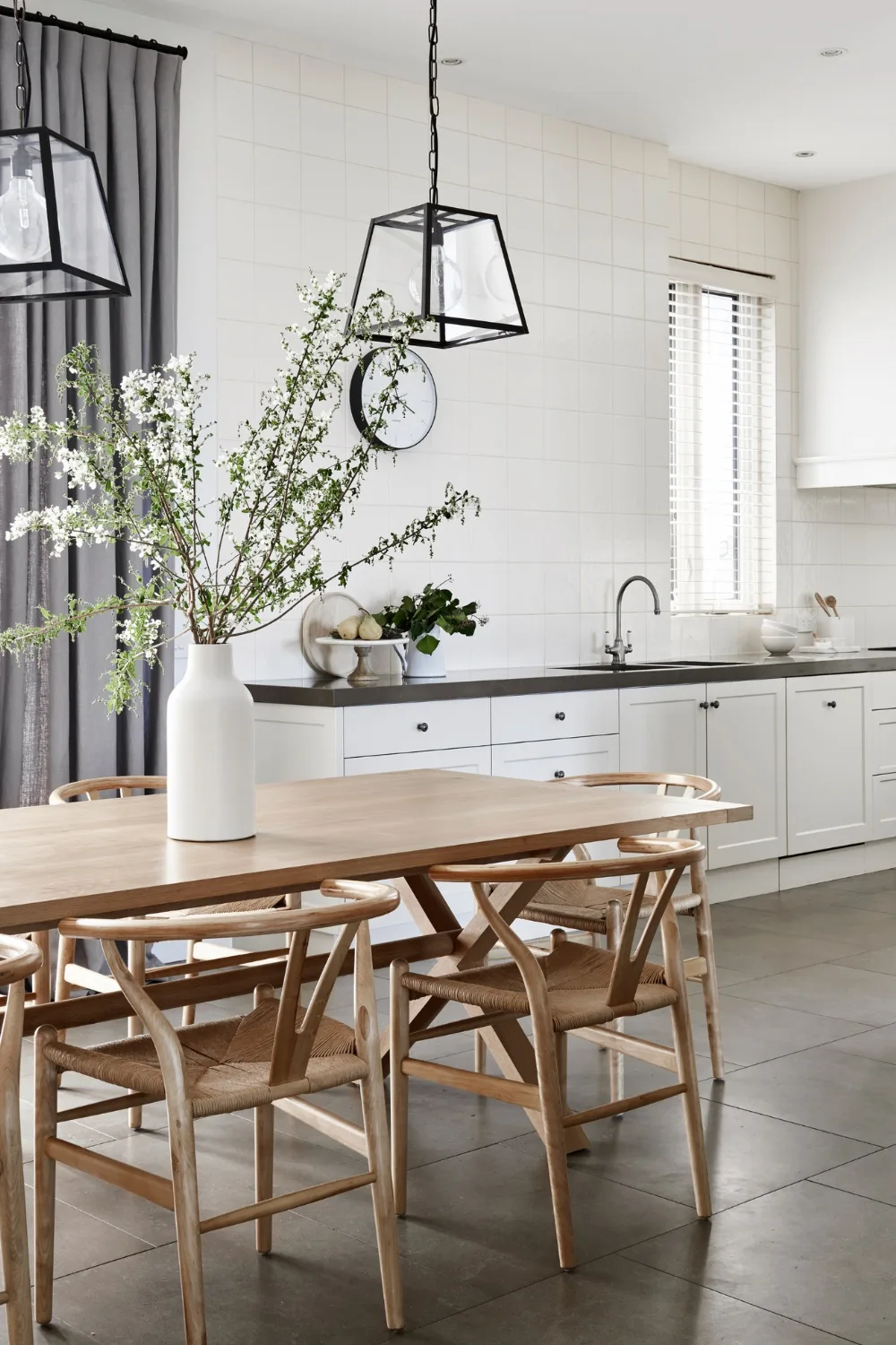 One wall kitchen with timber dining table in foreground