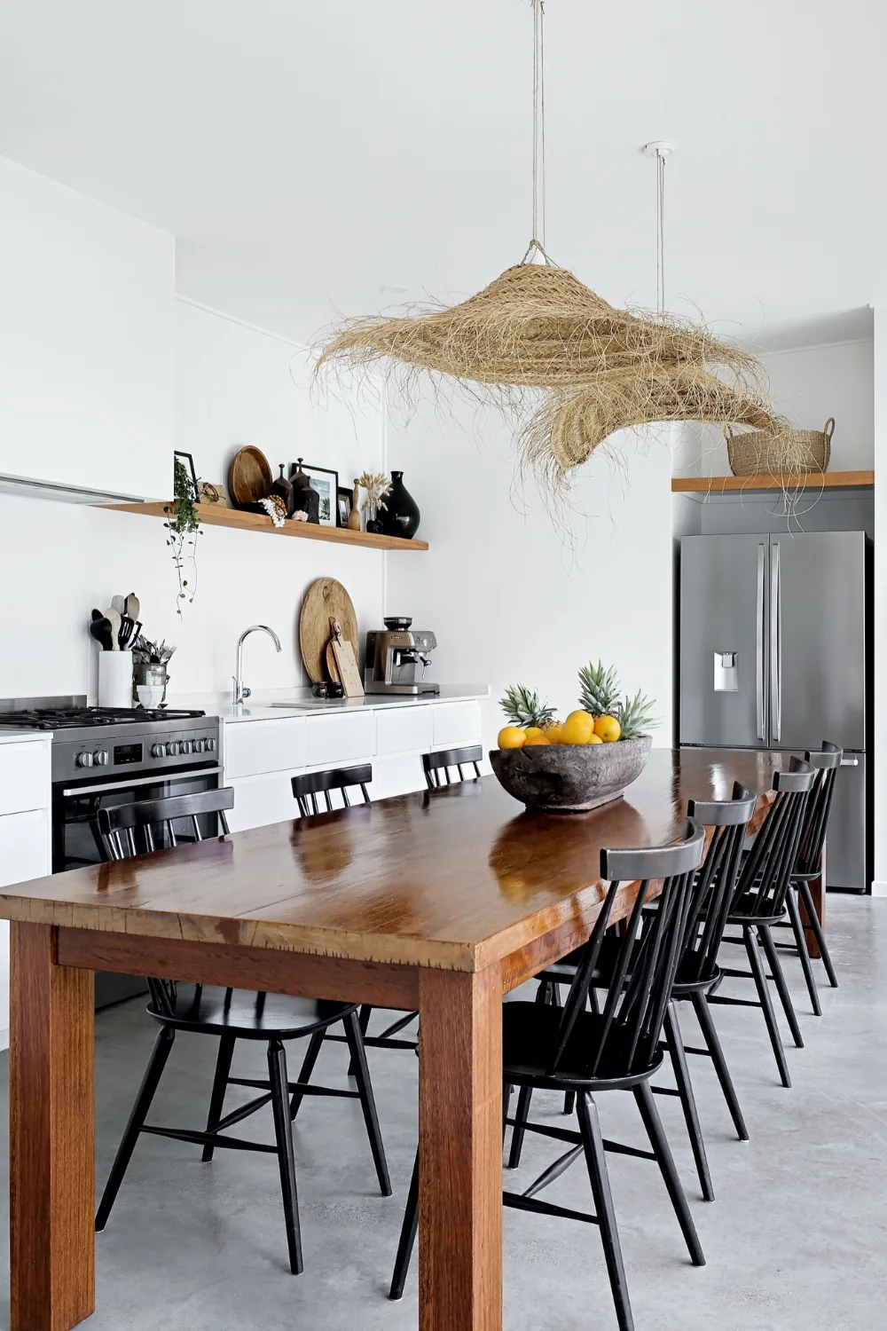 Coastal style kitchen with large wooden dining table