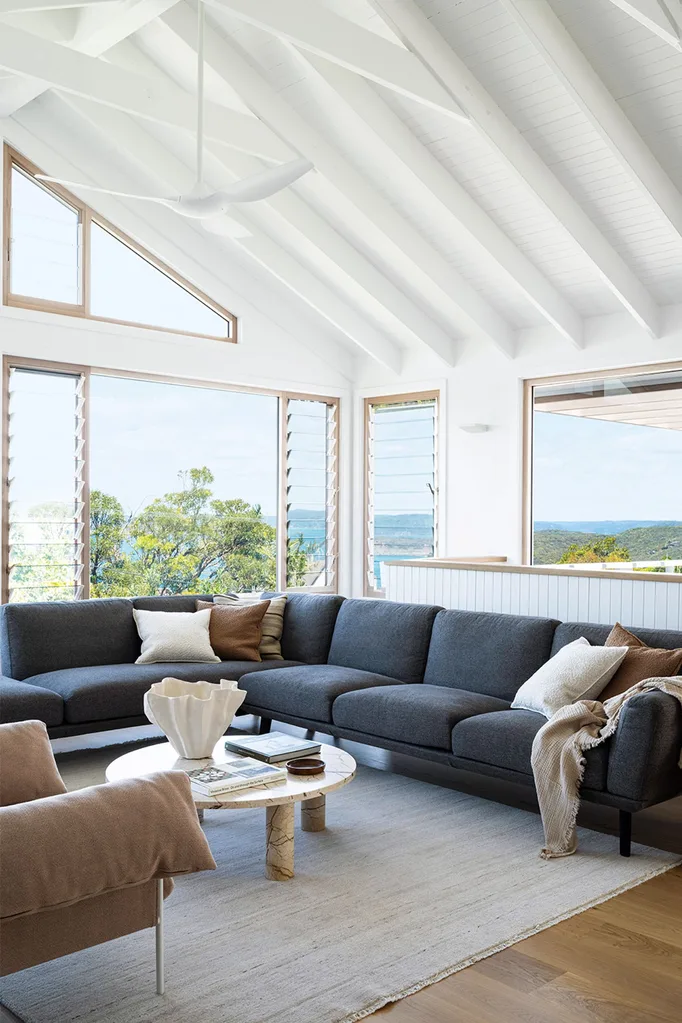 Contemporary coastal living with vaulted ceilings and exposed beams