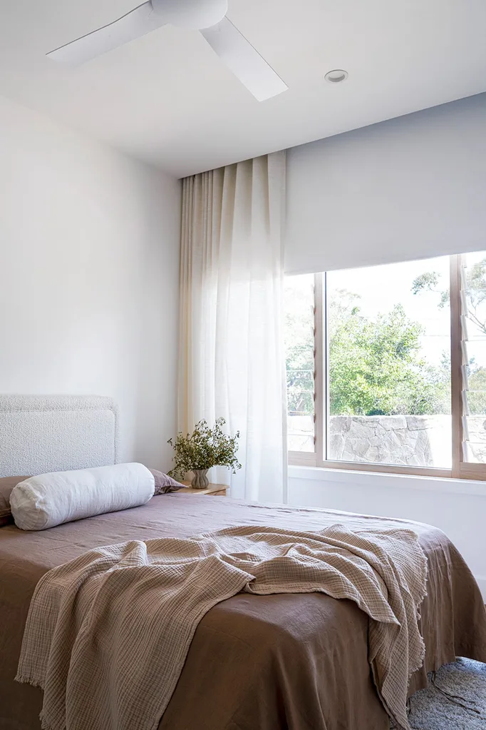 contemporary bedroom with sheer curtains