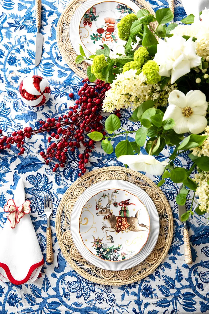 Classic blue and white Christmas table setting with a touch of red