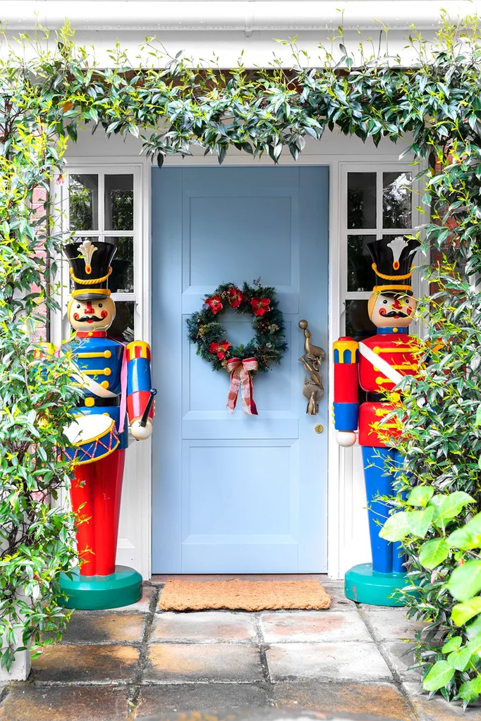 Giant nutcracker statues flank Amy Spargo's Christmas home entrance