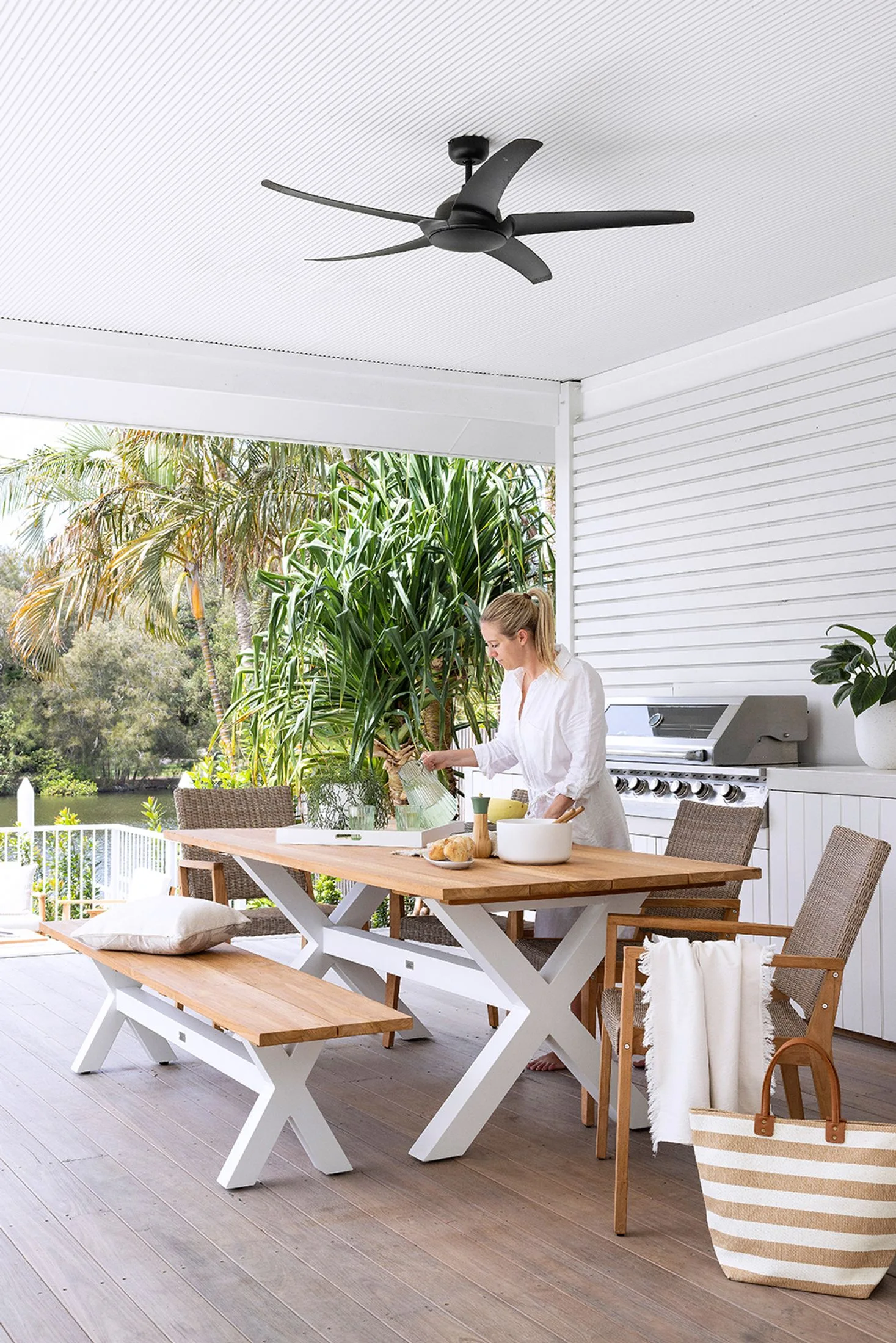 White exterior alfresco dining area with BBQ