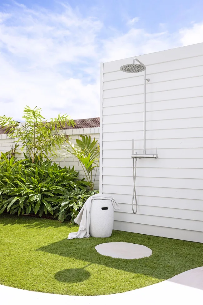 All white exterior weatherboard outdoor shower