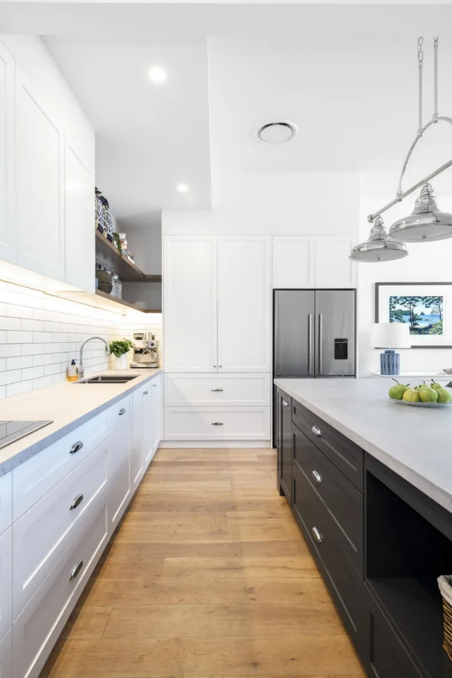 Galley style kitchen with a black and white colour scheme