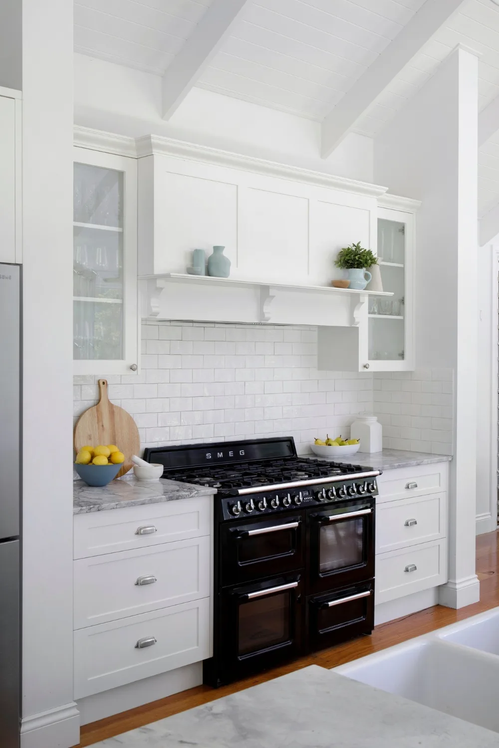 White and marble kitchen with shaker-style cabinet doors