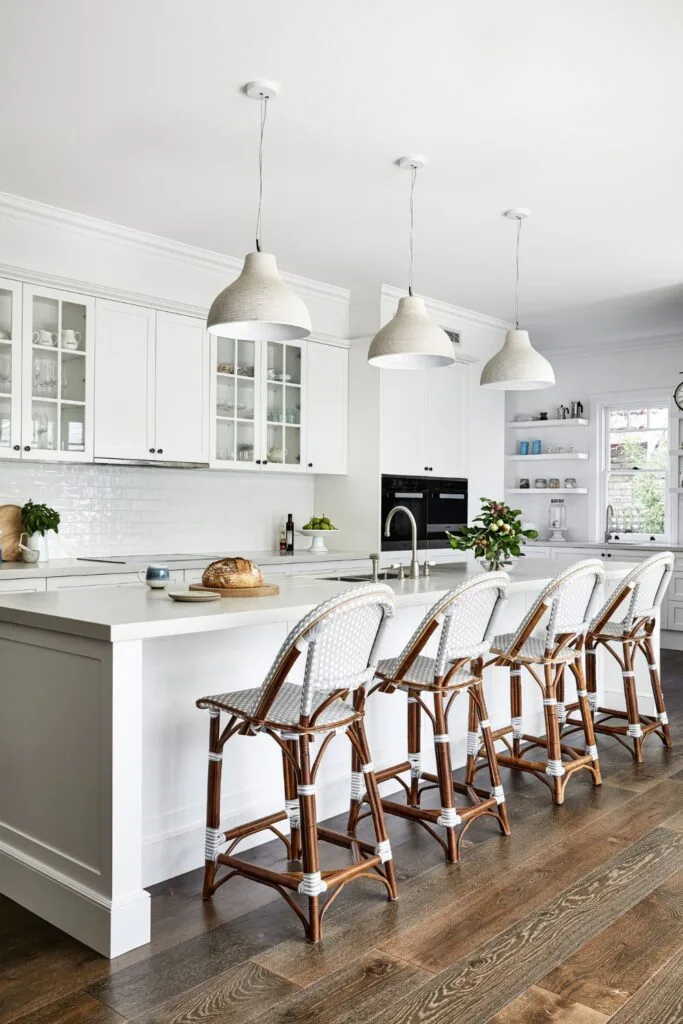 Hamptons style kitchen with white bell pendants