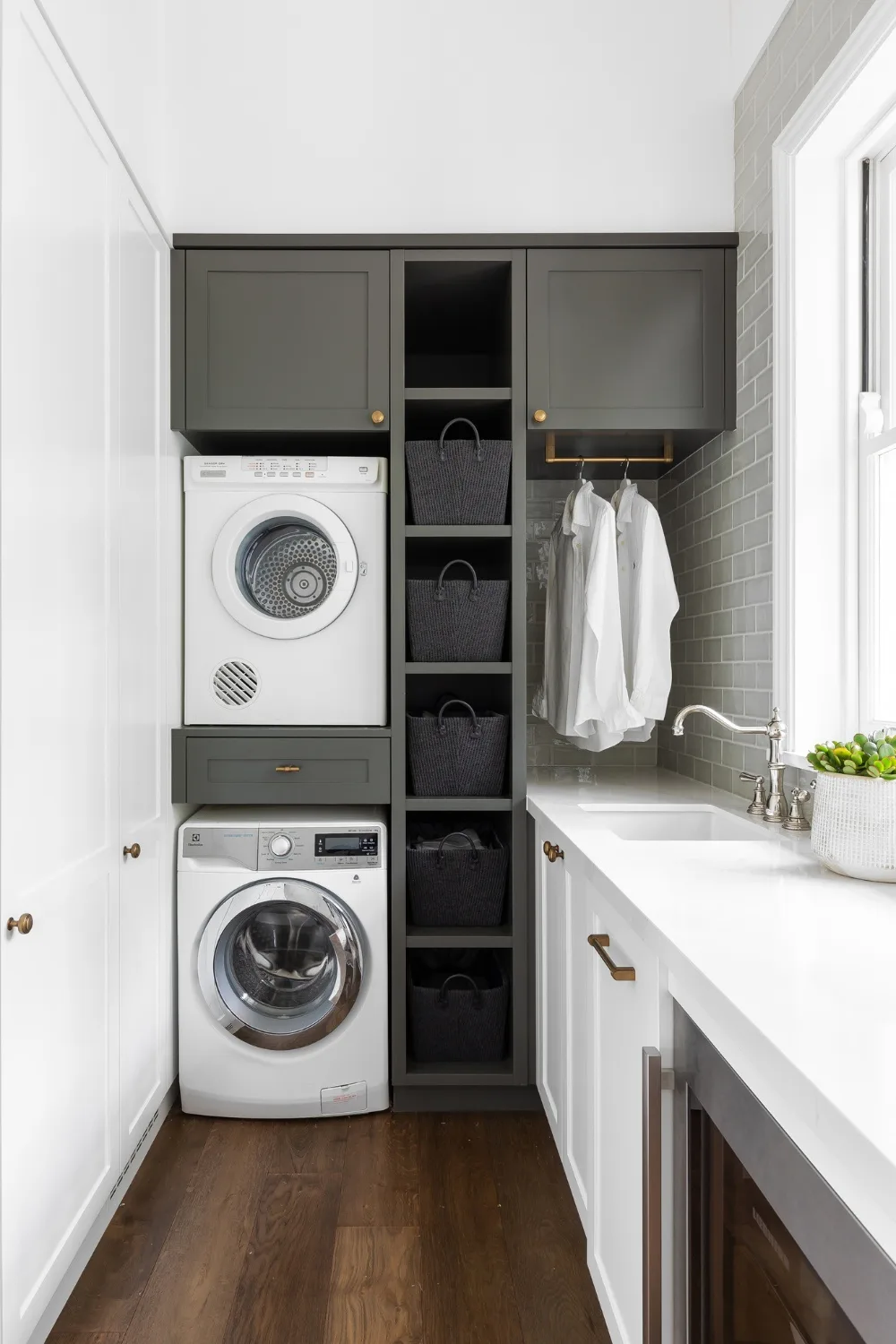 Classic grey and white laundry with stacked washer/dryer