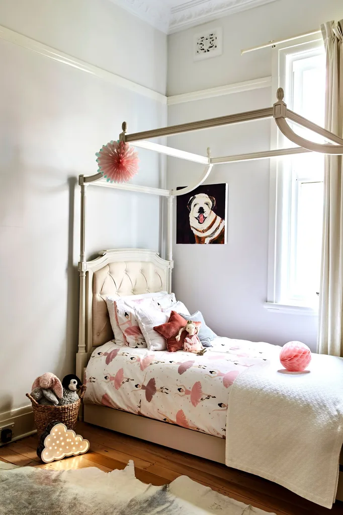kids room with four poster bed