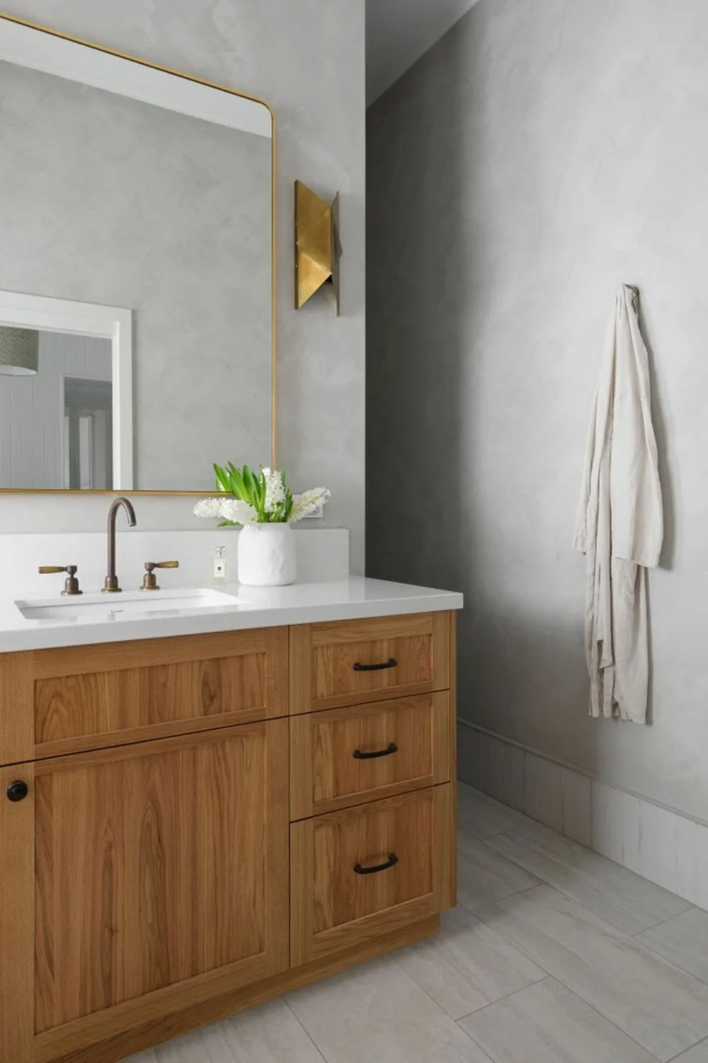 Timber bathroom with brass tapware