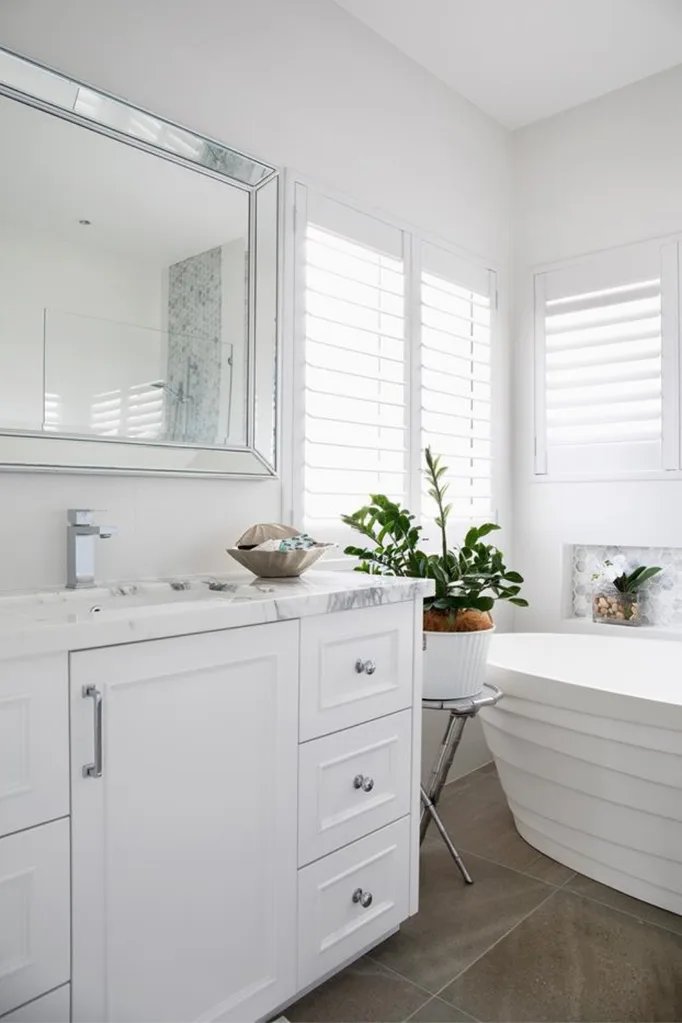 Hamptons style bathroom with plantation shutters