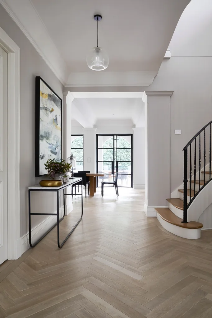 Modern minimalist entryway with herringbone floors