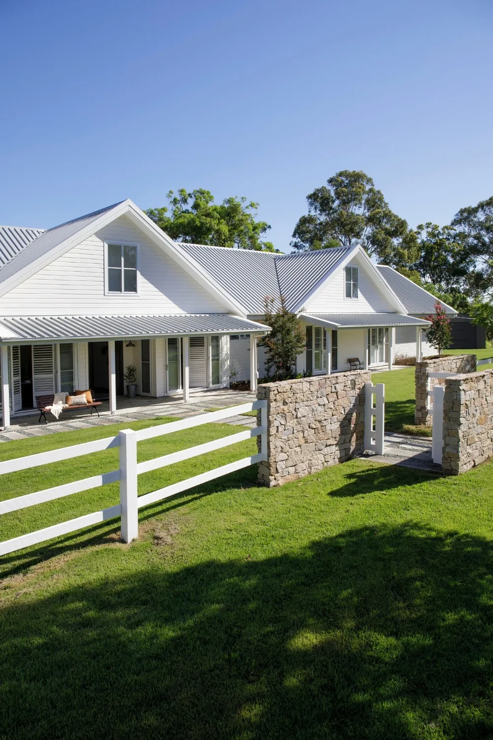 Farmhouse exterior painted in Dulux Antique White USA