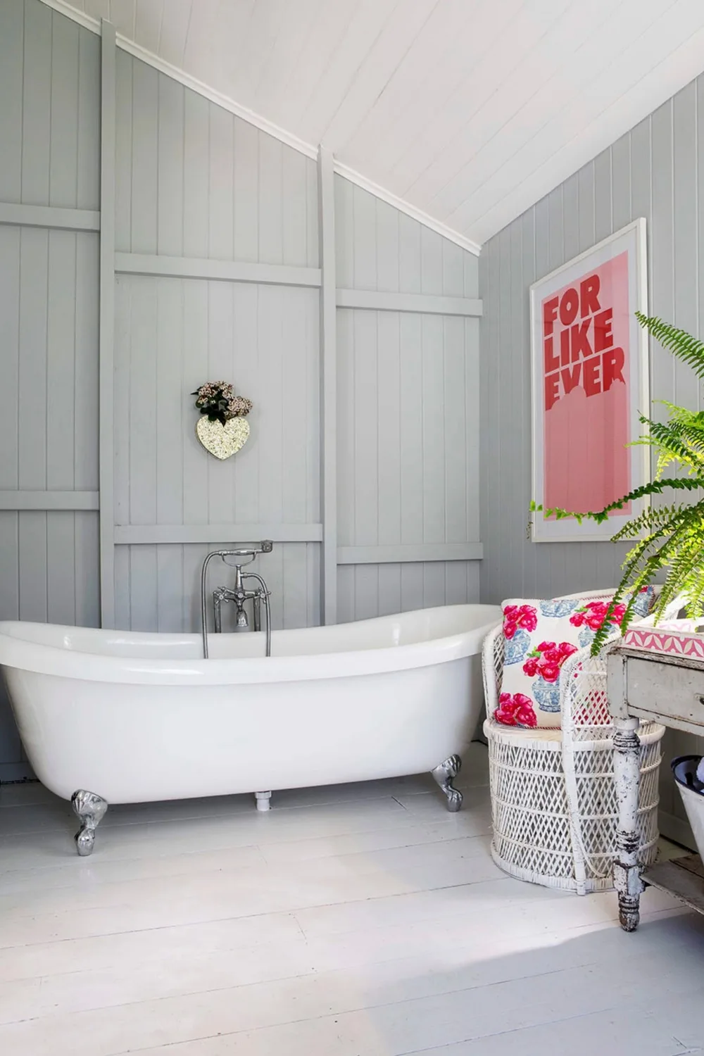 Claw-footed bath tub in French provincial style bathroom