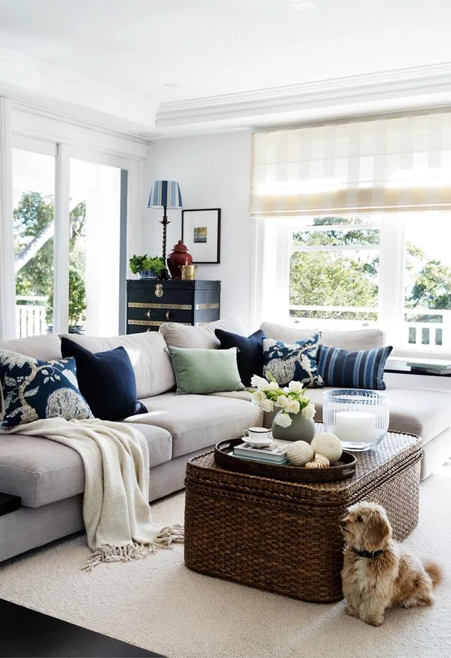 Light bright Hamptons style living room with L-shaped sofa