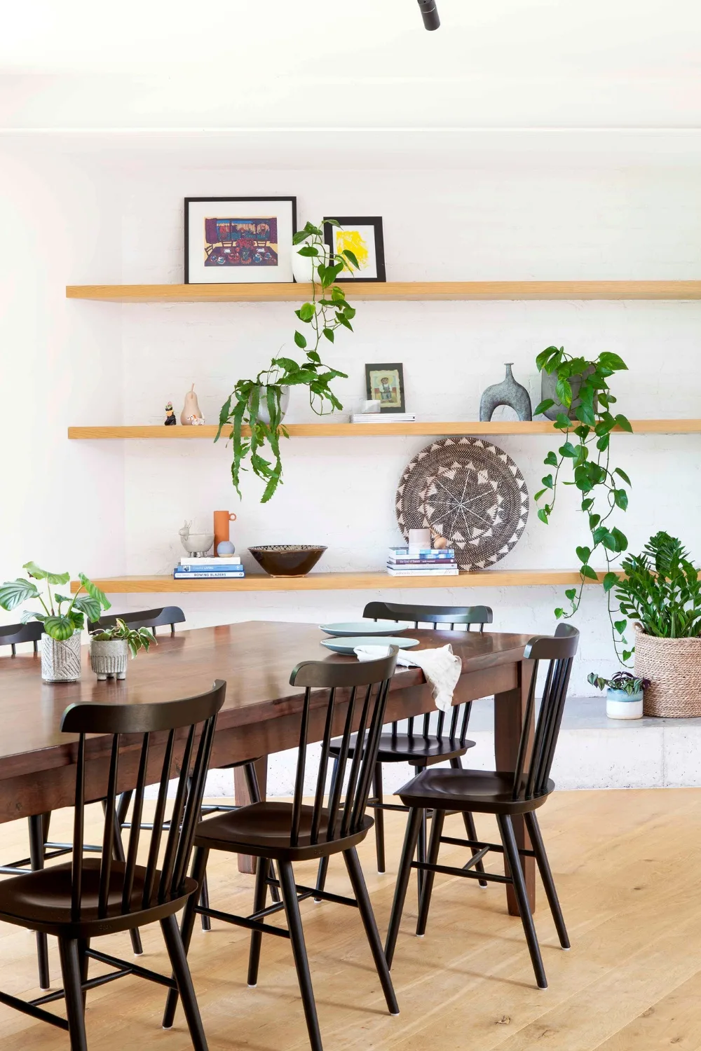 Dining room with indoor plants on floating shelves