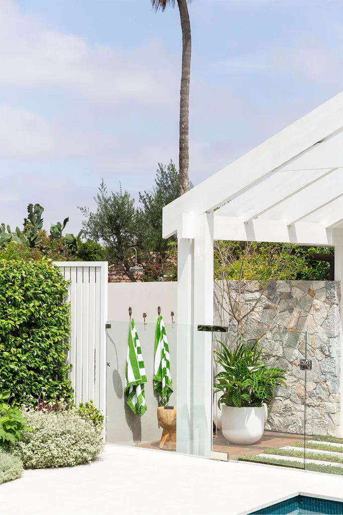 Poolside cabana with green striped poll towels