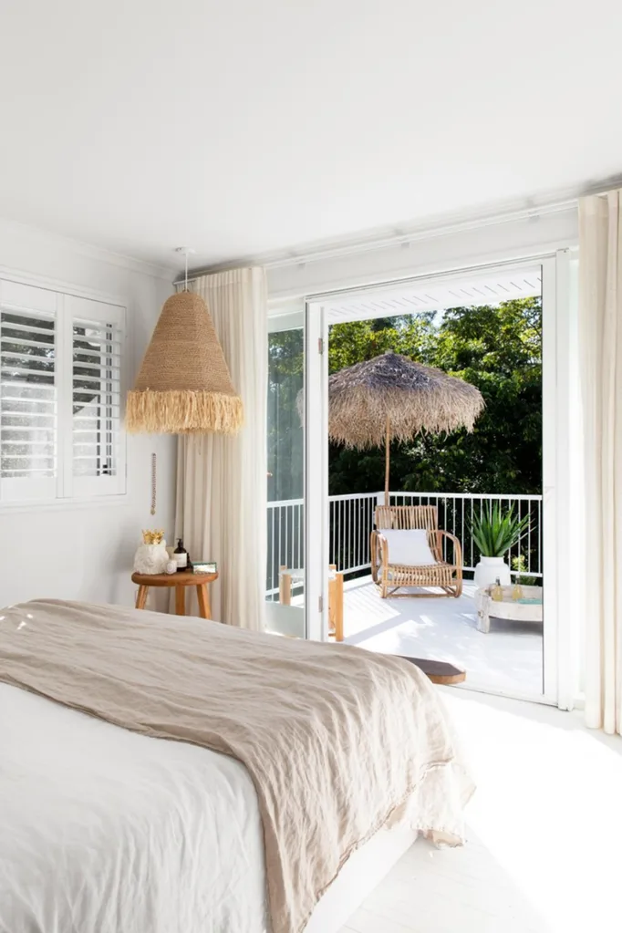 Coastal style bedroom with woven pendant lamp in corner