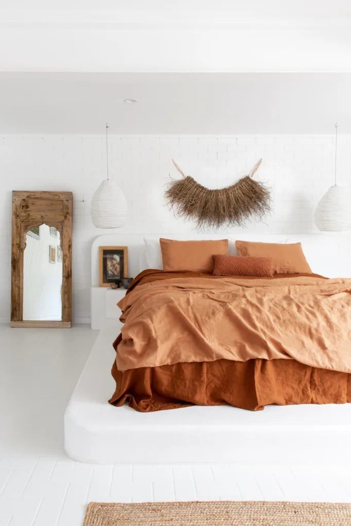 Boho style bedroom with orange ben linen