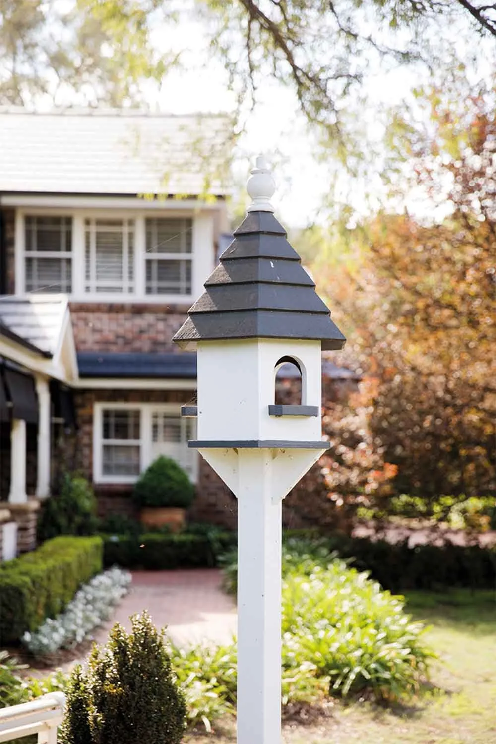 Bird house in Hamptons style garden