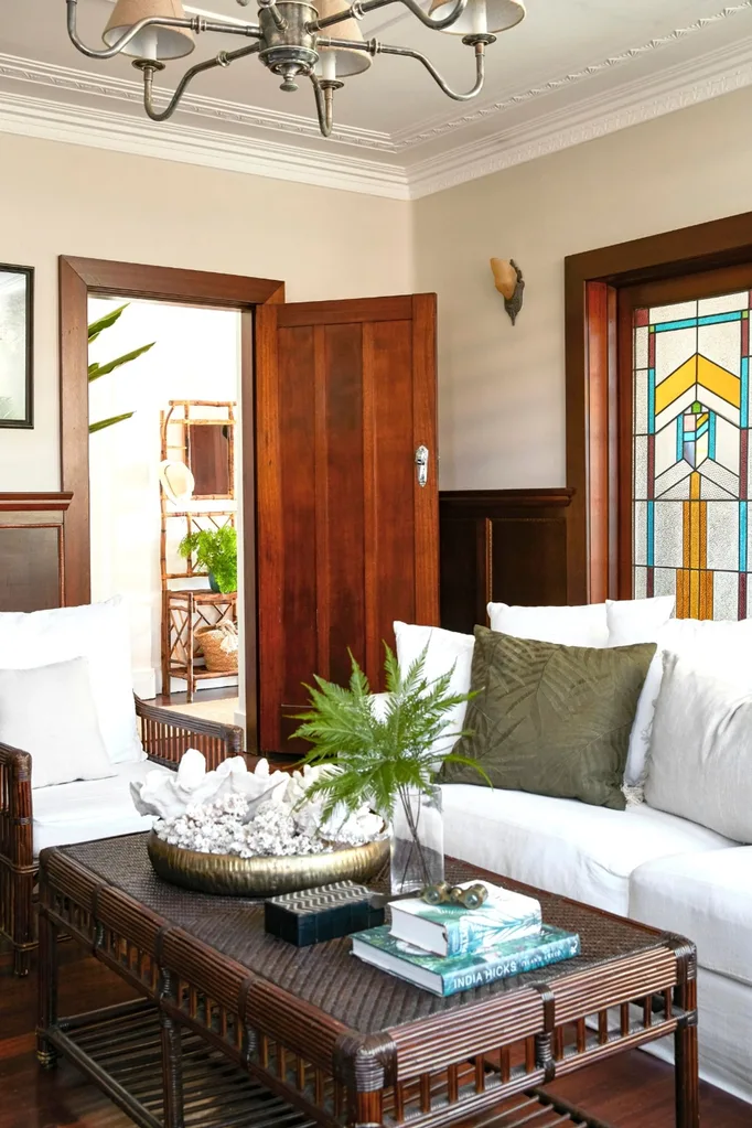 sitting area with white couch and stain glass windows