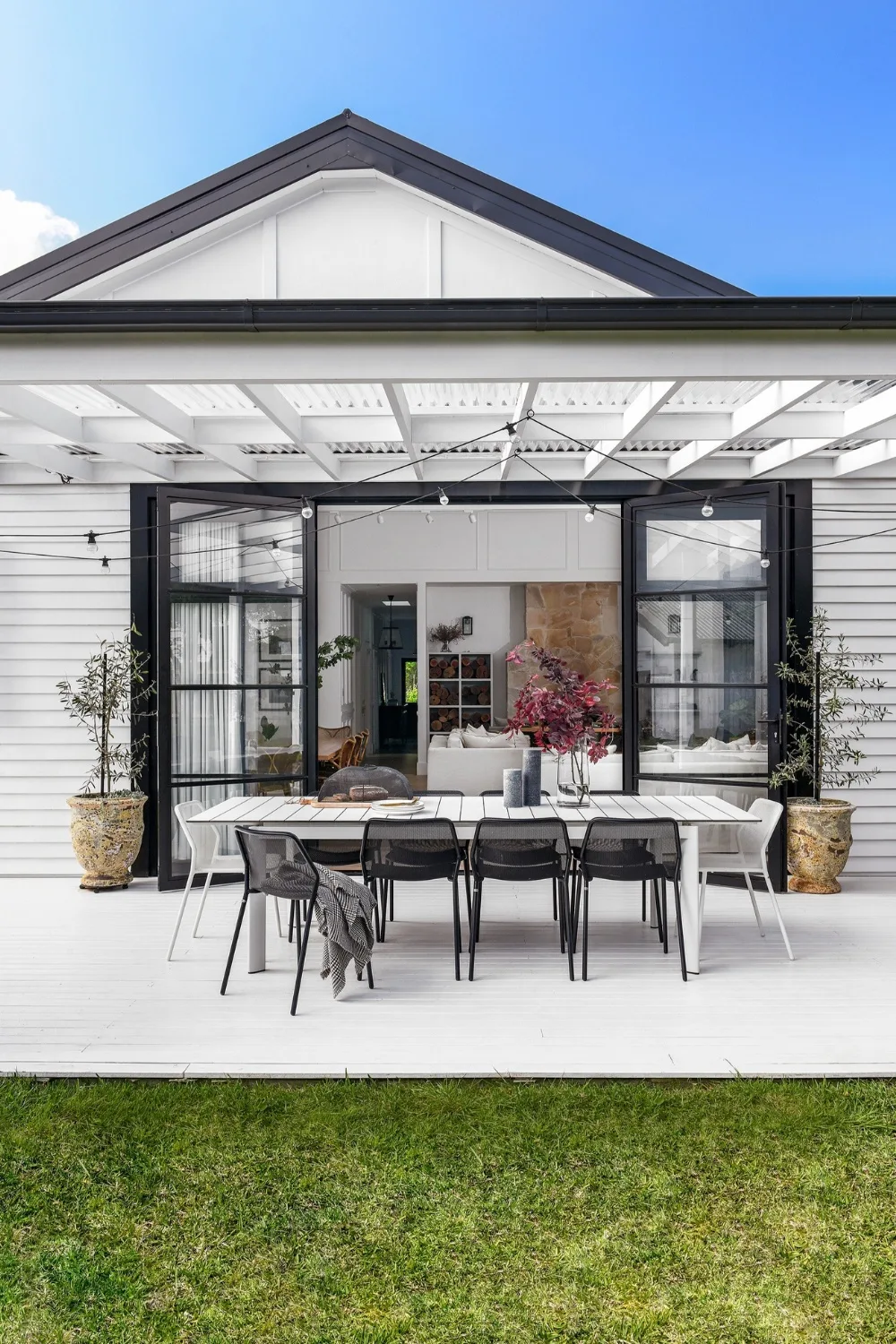 Rear of home with outdoor dining table