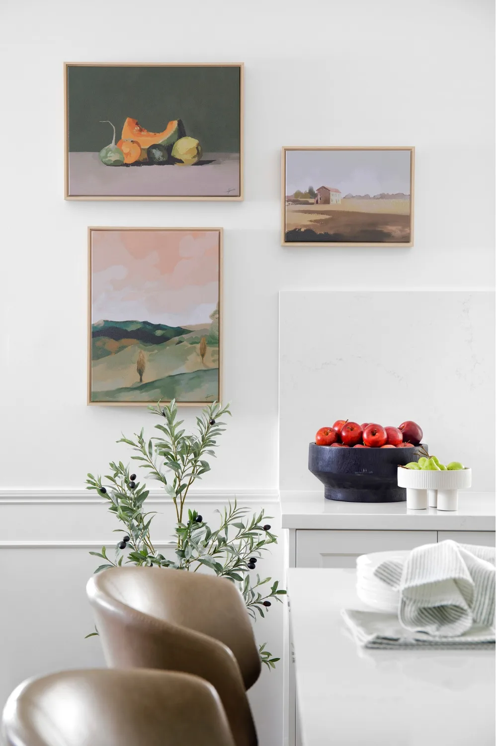 White kitchen with tomatoes and pears on countertop