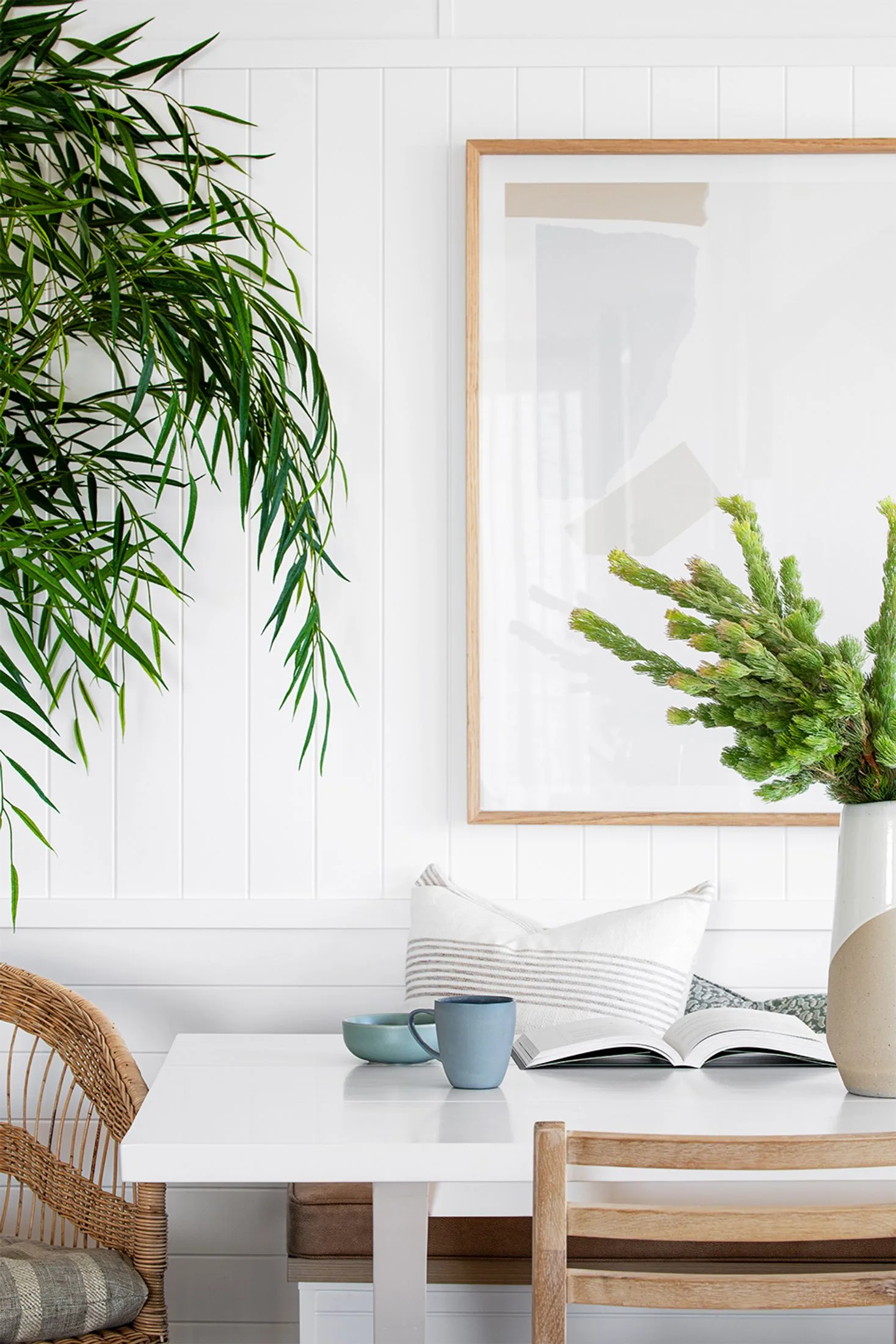 Coastal style dining nook with blue mug and bowl on the table